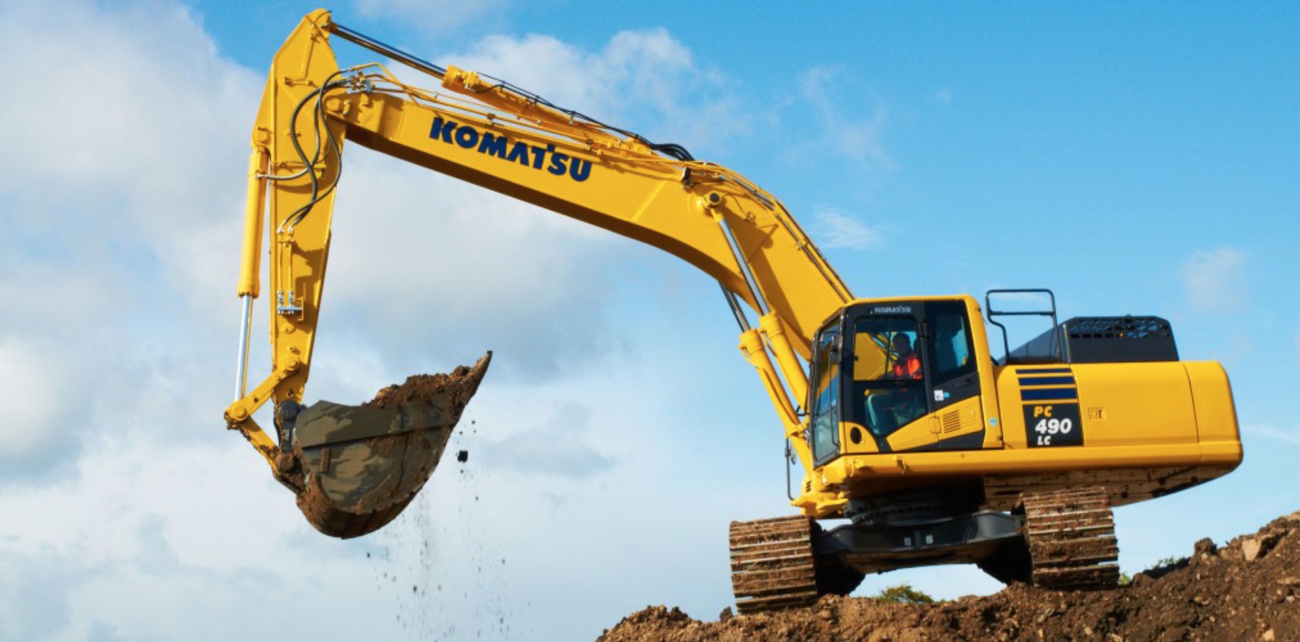 An excavator digger at work, digging soil up high