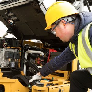 A mechanic fixing a digger.